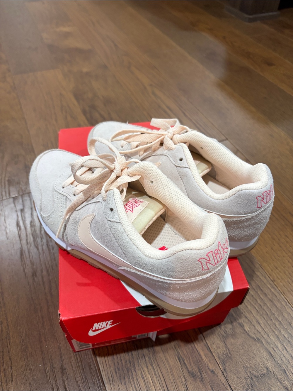Nike women’s Pink Suede Sneakers with Embroidered Logo